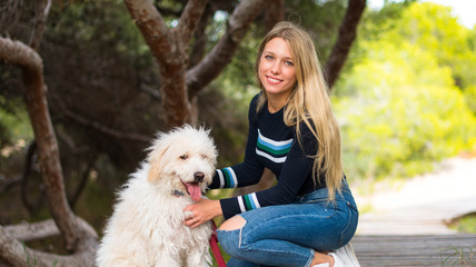Young girl with her dog in a park