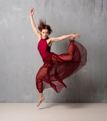 Young ballerina girl dancing