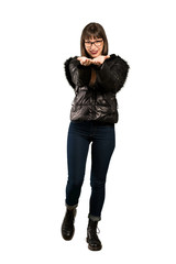 Full-length shot of Woman with glasses holding copyspace imaginary on the palm to insert an ad