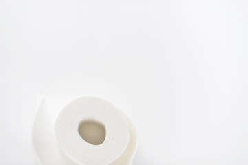 roll of white toilet paper on white background