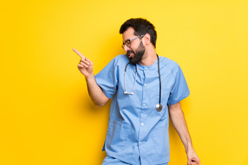 Surgeon doctor man enjoy dancing while listening to music at a party