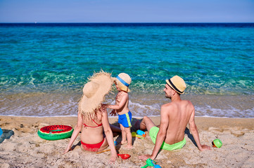 Family on beach in Greece