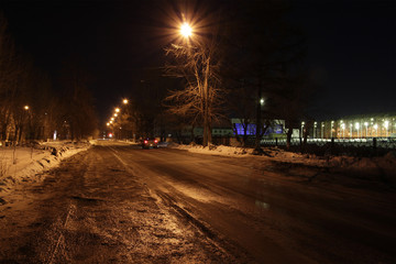 small icy road night city