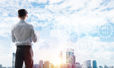 Concept of business success and control with confident boss against cityscape background