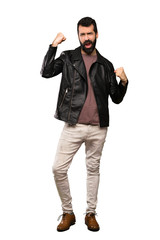 Naklejka premium Handsome man with beard celebrating a victory over isolated white background