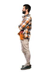 Craftsmen man in lateral position over isolated white background