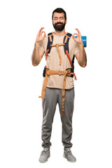 Hiker man in zen pose over isolated white background