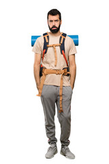 Hiker man with sad and depressed expression over isolated white background