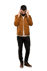 Fototapeta premium Handsome man with beard with headache over isolated white background