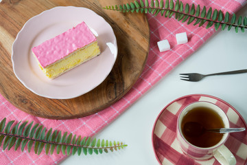 flat lay typical Dutch sweet pastry tompouce on pink plate,
