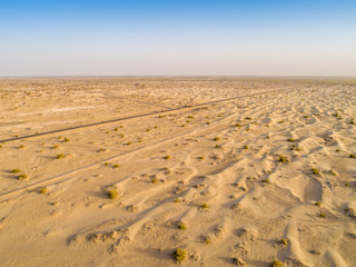 Sundown in desert.Big sand dunes panorama. Desert or beach sand textured background. 