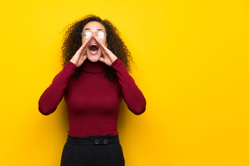 Dominican woman with turtleneck sweater shouting and announcing something