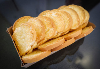 toast bread with sugar on dark table for breakfast