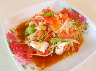 Papaya salad with satled eggs on plate hot and spicy thai food with yardlong bean