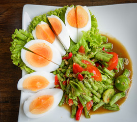 Yardlong bean salad spicy and boiled egg thai food asian / Vigna unguiculata subsp