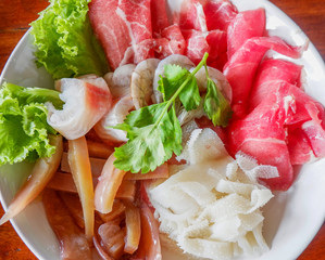 Set of shabu fresh raw meat beef pork and squid shrimp fish seafood and vegetable on bowl