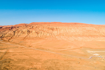 The Flaming Mountains are barren eroded red sandstone hills in Tian Shan Mountain range Xinjiang China. 