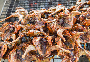 Grilled quail on the grill grate / marinated of roasted quail bird for cooked food