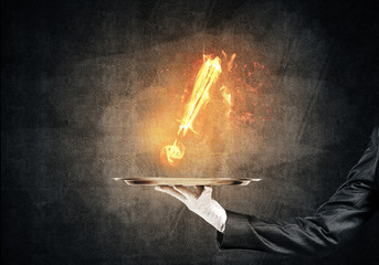 Waitress's hand keeping flaming exclamation mark