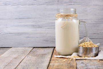 Vegan non dairy  oat milk  in a jar with copy space