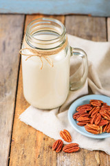 Vegan non dairy pecan  milk  in a jar with copy space