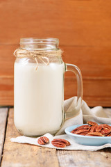 Vegan non dairy pecan  milk  in a jar with copy space