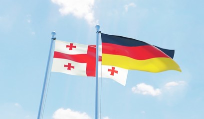 Germany and Georgia, two flags waving against blue sky. 3d image