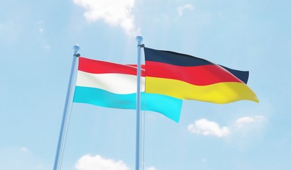 Germany and Luxembourg, two flags waving against blue sky. 3d image
