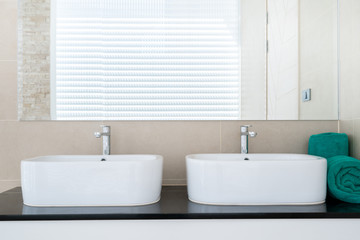 Fototapeta na wymiar Luxury bathroom features basin, toilet in the house or home building