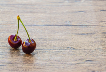 Cherry berries on a wooden background. Ripe red sweet cherry