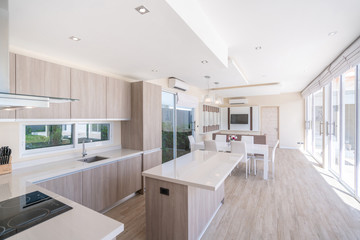 house or home building Luxury interior design in living room of pool villas. Airy and bright space with high raised ceiling and dining table