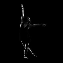Fototapeta na wymiar Girl ballet dancer on black background