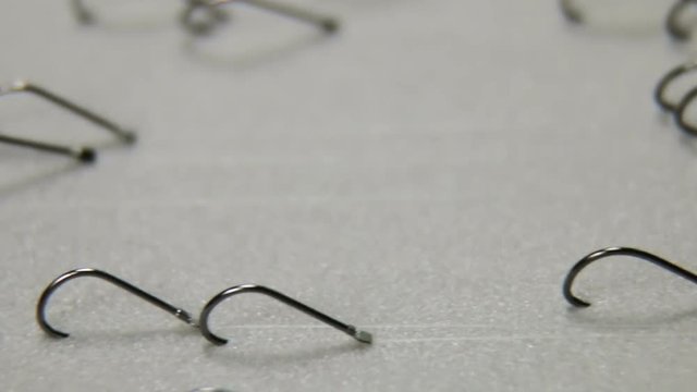 lots of fishing hooks on a fishing line. fishing leashes and accessories. Fishing tackle and accessories. Shallow depth of field