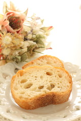 French bread on dish with flower