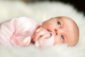 newborn baby looking up