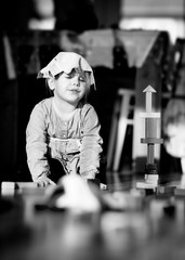 girl playing with wooden bricks