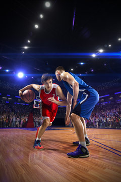 Basketball Player N Action. Around Arena With Blue Light Spot