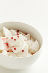 chopped Japanese radish Daikon and red pepper in vinegar