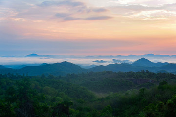 Beautiful sky sunrise asia landscape on hill with fog mist in the morning background