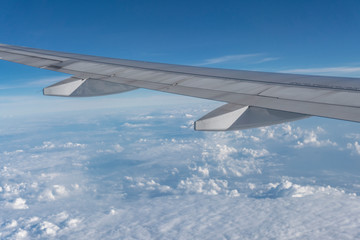 Plane wings are in the atmosphere