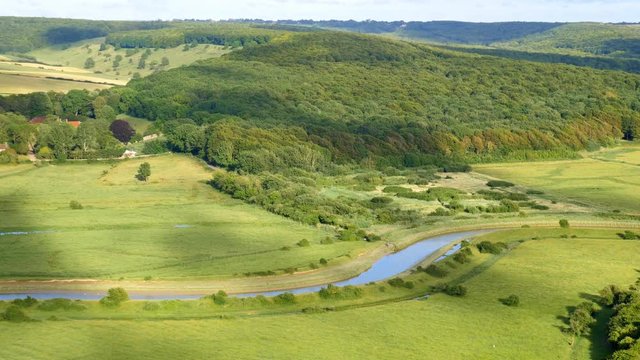 View from the High and Over Hill on the Friston Forest and the Cuckmere River floodplain. South Downs, East Sussex, England.