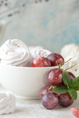 Homemade zephyr and mint on an old wooden table covered 