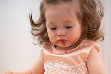 Cute little girl with a dirty sticky face