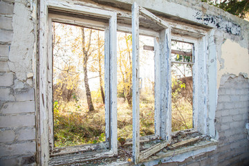 broken window in an abandoned house indoor closeup
