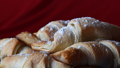 croissants on a blue dish on a red background
