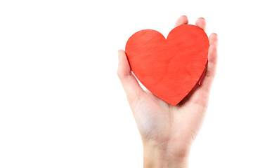 Obraz premium Female hand isolated on white background. White woman's hand showing symbols and gestures. Red wooden heart in hand. Love