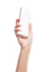 Silver power bank on hand isolate. Power bank for charging mobile devices. Smart phone charger with power bank. battery bank. External battery for mobile devices.