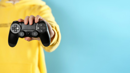  Young calm lady holding joystick in her hands © brizmaker