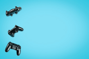 Photo of modern black gamepad against colorful background © brizmaker