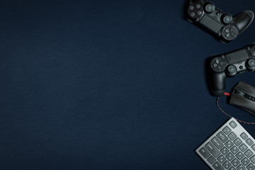 Photo of modern black gamepad lying on dark background © brizmaker